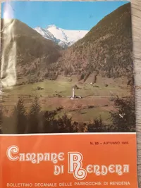 a magazine cover with an image of a view across a valley. The valley floor holds open fields, with a single small church in the centre. The hills beyond are wooded, and further up a valley is a snow-capped mountain. The text reads: 'Campane di Rendena'